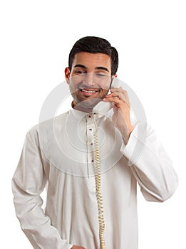Middle eastern arab man using the telephone photo