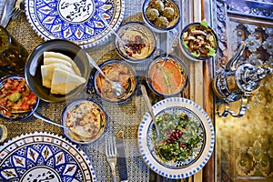 Middle eastern or arabic dishes and assorted meze, concrete rustic background