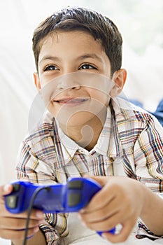 Middle Eastern boy playing a video game