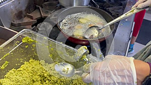 Middle eastern chef preparing falafel balls