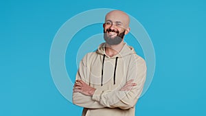 Middle eastern confident person posing on studio camera