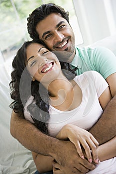 A Middle Eastern couple cuddling