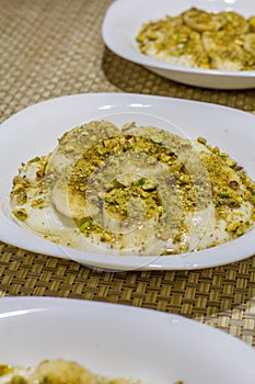 Middle eastern creamy dessert with nuts and honey