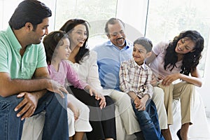 Middle Eastern family sitting together photo