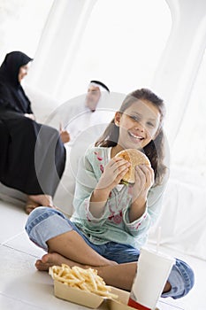 A Middle Eastern girl enjoying fast food