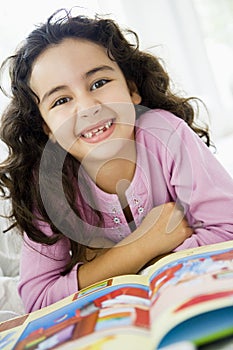 Middle Eastern girl reading