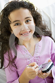 Middle Eastern girl using a PDA