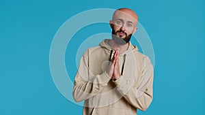 Middle eastern man praying to Allah for forgiveness