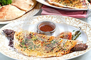 Middle Eastern Pita bread with rolled lamb