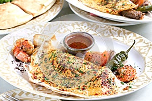 Middle Eastern Pita bread with rolled lamb