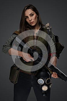 Middle Eastern Survivalist Woman with Rifle photo