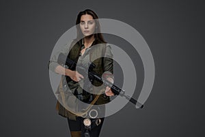 Middle Eastern Survivalist Woman with Rifle photo