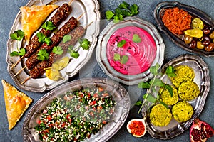 Middle Eastern traditional dinner. Authentic arab cuisine. Meze party food. Top view, flat lay, overhead.