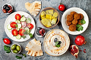 Middle Eastern traditional dinner. Authentic arab cuisine. Meze party food. Top view, flat lay, overhead. photo