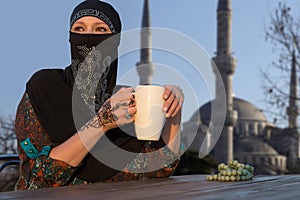Middle Eastern Woman at Cafe Terrace