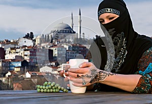 Middle Eastern Woman at Cafe Terrace