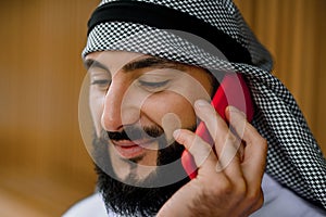 Middle eastern young man talking on the phone