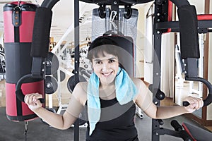 Middle easterners woman with a weight machine