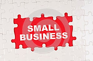 In the middle of the puzzles on a red background it is written - SMALL BUSINESS