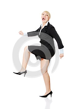 Middleaged businesswoman running