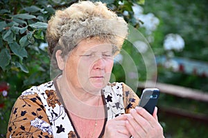 Middleaged woman talks on mobile phone