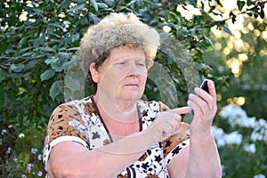 Middleaged woman talks on mobile phone