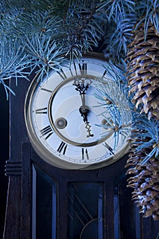 Midnight antique clock and a Christmas tree