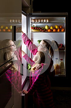 Midnight snack, looking into fridge