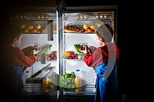 Midnight snack, looking into fridge