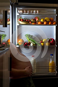 Midnight snack, looking into fridge