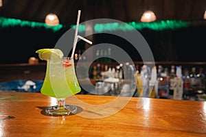 Midori sour cocktail on counter bar