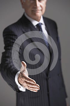 Midsection Of Businessman Offering Hand