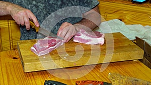 Midsection of butcher cutting meat