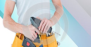 Midsection of handy man holding drill on blue and white stripes