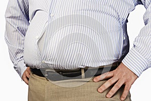 Midsection Of An Obese Man Wearing Tight Formal Shirt