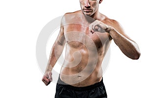 Midsection of shirtless athlete exercising
