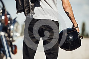 midsection view of male biker holding