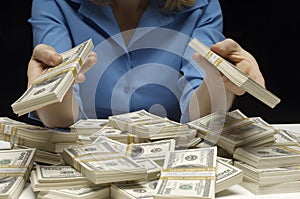 Midsection Of A Woman Holding Dollars photo