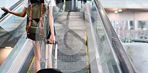 Midsection Woman With Luggage Traveling at Airport