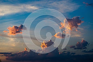 Midsized orange cumulus clouds