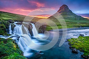 Midsummer night sunset at Kirkjufellsfoss Waterfall in West Iceland