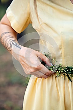 Midsummer solstice ritual. Celebrating summer solstice. Significance of the solstice in Paganism. Woman with herbs