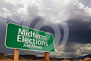 Midterm Elections Green Road Sign Over Dramatic Clouds and Sky photo