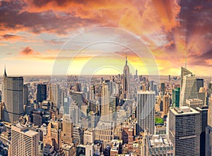 Midtown Manhattan at sunset, New York City. Panoramic aerial view of city skyscrapers at dusk