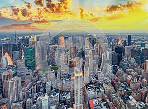 Midtown Manhattan at sunset, New York City. Panoramic aerial view of city skyscrapers at dusk