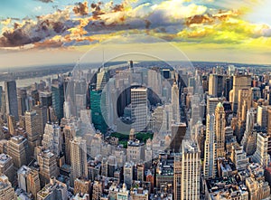 Midtown Manhattan at sunset, New York City. Panoramic aerial view of city skyscrapers at dusk