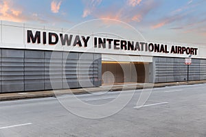 Midway International Airport sign at sunset.