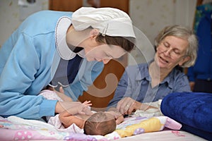 Midwife with baby