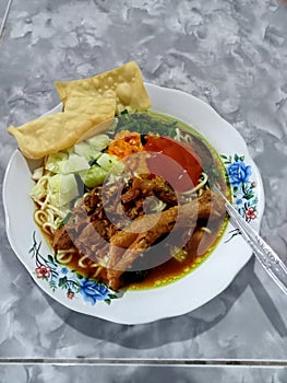 Mie ayam This is a typical regional Indonesian food served with vegetables and chili sauce