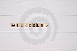 Miercoles week day name on white wooden background photo